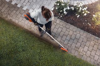 Edging a lawn using a Husqvarna combi trimmer