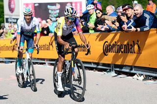 Ineos Grenadiers' Colombian rider Egan Bernal (R) rides to crosses the finish line in the 16th stage of the 108th Giro d'Italia cycling race of 203kms from Piazzola sul Brenta to San Valentino on May 27, 2025. (Photo by Luca Bettini / AFP)