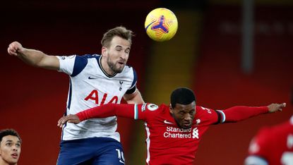  Tottenham’s Harry Kane and Liverpool’s Georginio Wijnaldum battle for a header  