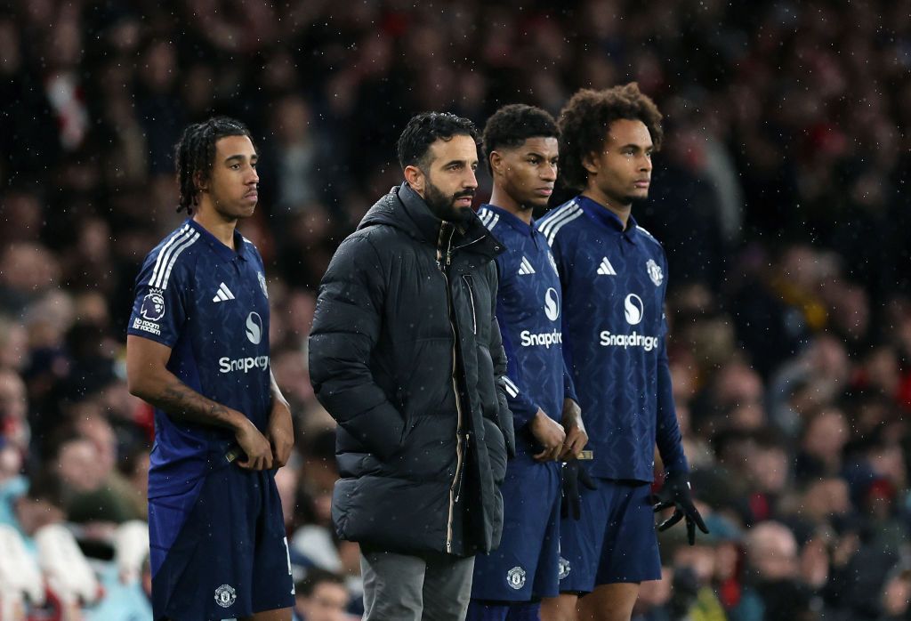 LONDON, ENGLAND - DECEMBER 04: Ruben Amorim Manager / Head Coach of Manchester United stands with Leny Yoro, Marcus Rashford and Joshua Zirkzee as they wait to come on as substitutes during the Premier League match between Arsenal FC and Manchester United FC at Emirates Stadium on December 04, 2024 in London, England. (Photo by Catherine Ivill - AMA/Getty Images)