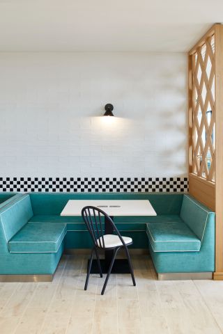 Blue couches and table in cafe setting