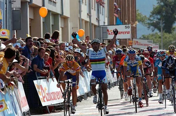 Paolo Bettini takes the win.