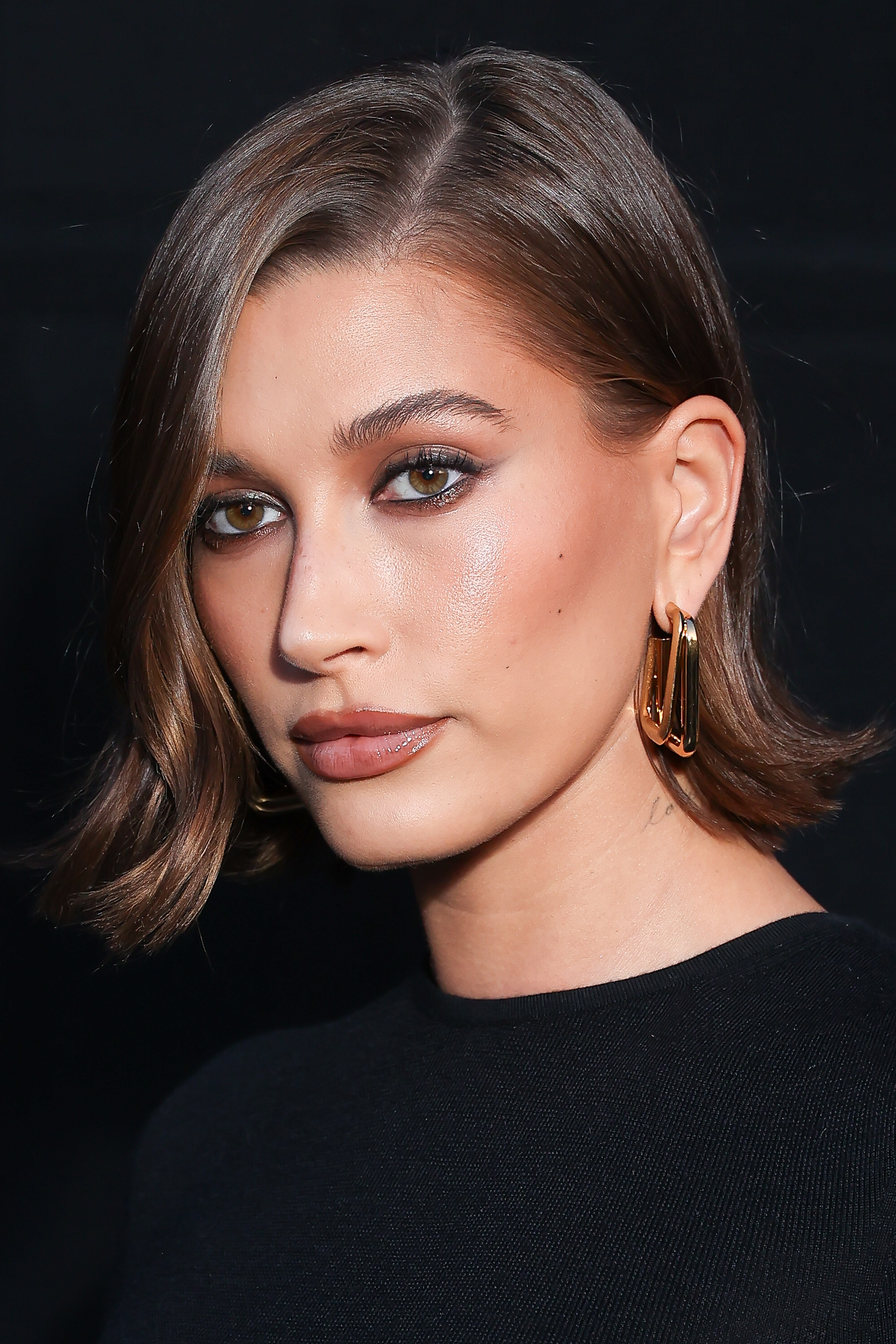 Hailey Bieber attends the Saint Laurent womenswear spring/summer 2024 show during Paris Fashion Week.