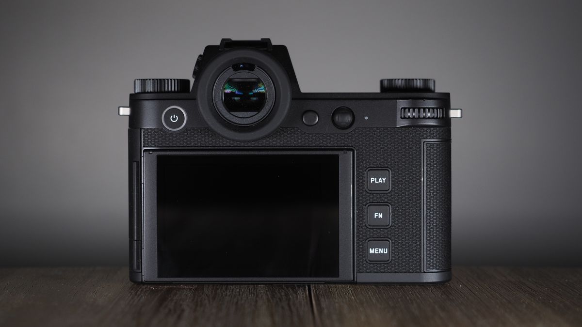 Leica SL3-S on a wooden surface with moody lighting