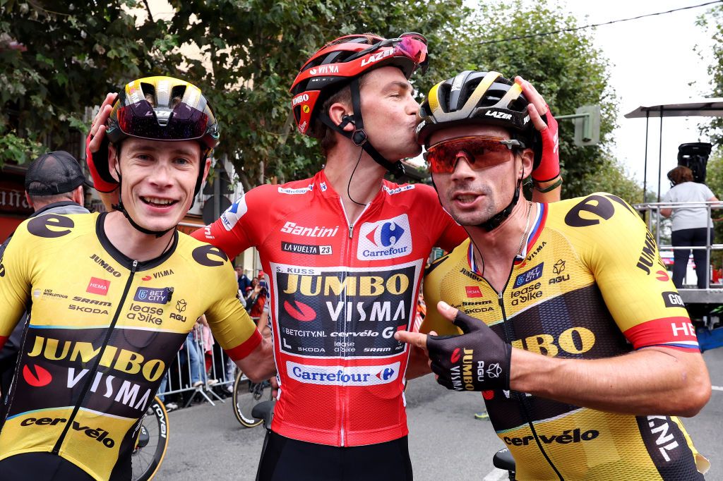 GUADARRAMA SPAIN SEPTEMBER 16 LR Jonas Vingegaard of Denmark Sepp Kuss of The United States Red Leader Jersey final overall winner and Primo Roglic of Slovenia and Team JumboVisma celebrate the victory during the 78th Tour of Spain 2023 Stage 20 a 2078km stage from Manzanares El Real to Guadarrama UCIWT on September 16 2023 in Guadarrama Spain Photo by Alexander HassensteinGetty Images