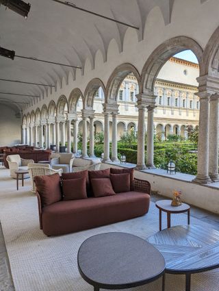 brown outdoor sofa in a palatial courtyard