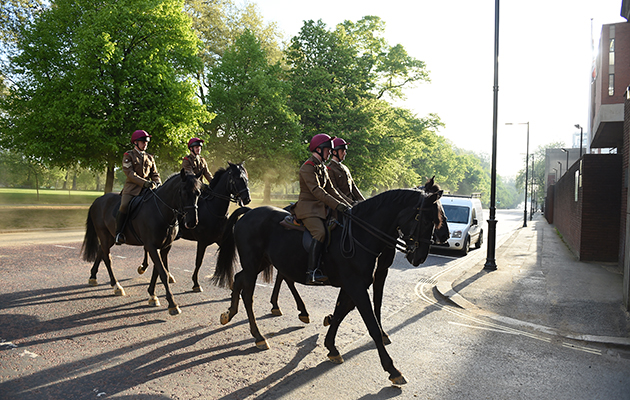 Soldiers return from &lsquo;Watering order&rsquo;, where horses are exercised around the streets of West London