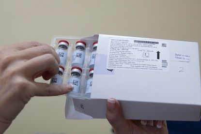 A container holding several Johnson & Johnson vaccines.