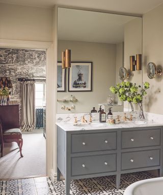 Double vanity, grey drawers, tile floor