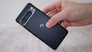 A photo of the Google Pixel 8 Pro being held in reviewer's hand