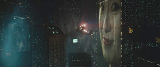 Screenshot from Blade Runner showing the iconic and enormous digital billboard.