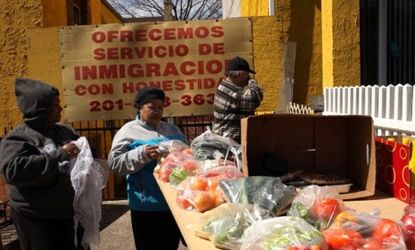 Hispanic women shop at a farmers market outside a Latino church in Union City, N.J.
