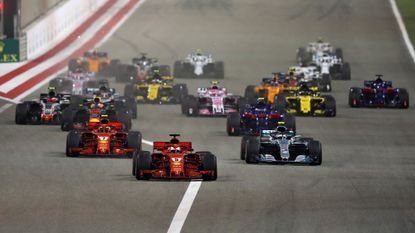  Sebastian Vettel of Germany driving the (5) Scuderia Ferrari SF71H leads Kimi Raikkonen of Finland driving the (7) Scuderia Ferrari SF71H, Valtteri Bottas driving the (77) Mercedes AMG Petronas F1 Team Mercedes WO9 and the rest of the field at the start during the Bahrain Formula One Grand Prix at Bahrain International Circuit on April 8, 2018