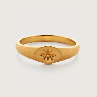 flat lay of gold ring 