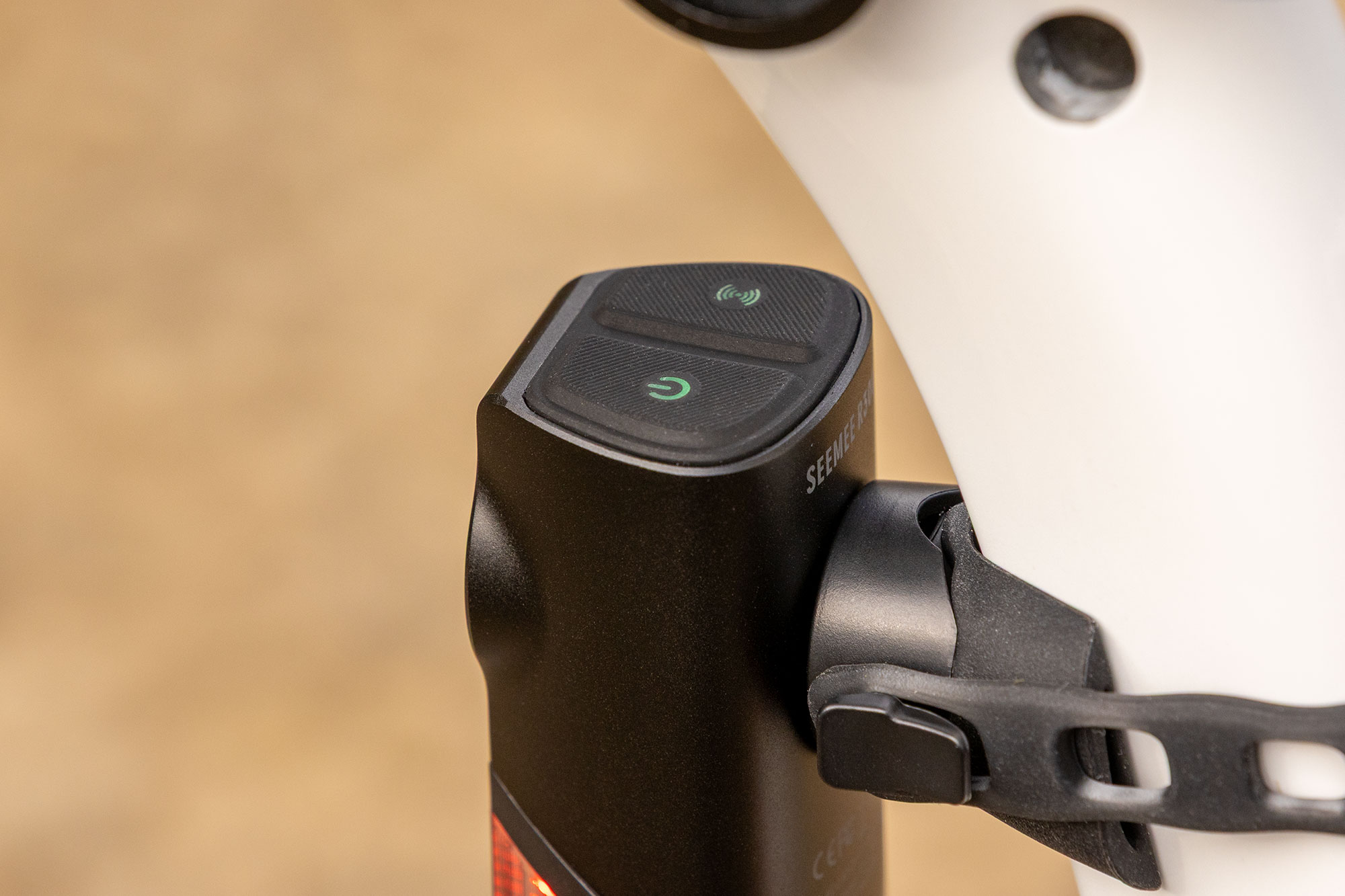 Image of the top of the Magicshine Seemee R300, showing the two large illuminated buttons. One for powering on the unit, the other solely for the radar.