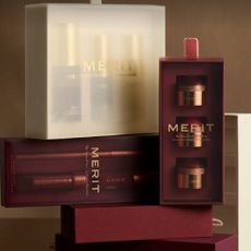 A variety of MERIT Beauty products stacked on top of each other.