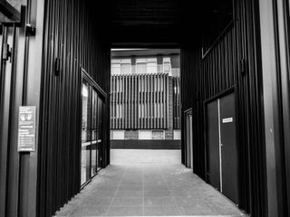 black & white image of a building passageway