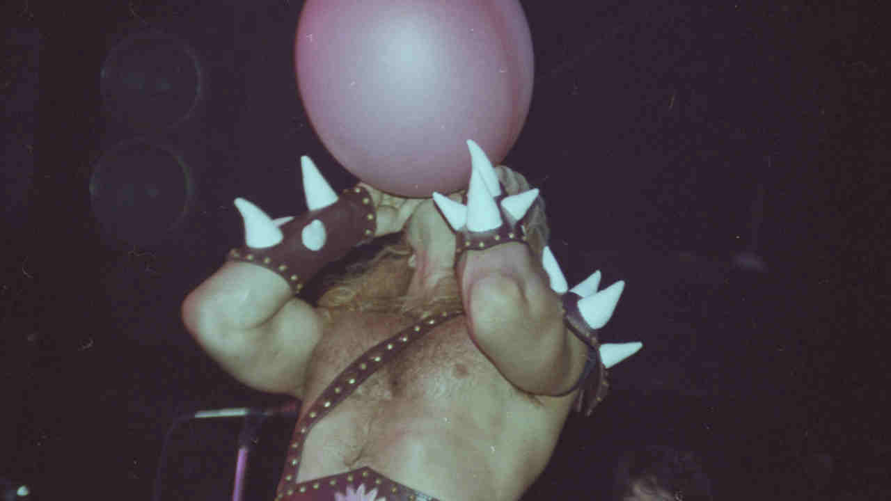 Heavy metal musician Thor inflating a hot water bottle onstage in the early 1980s