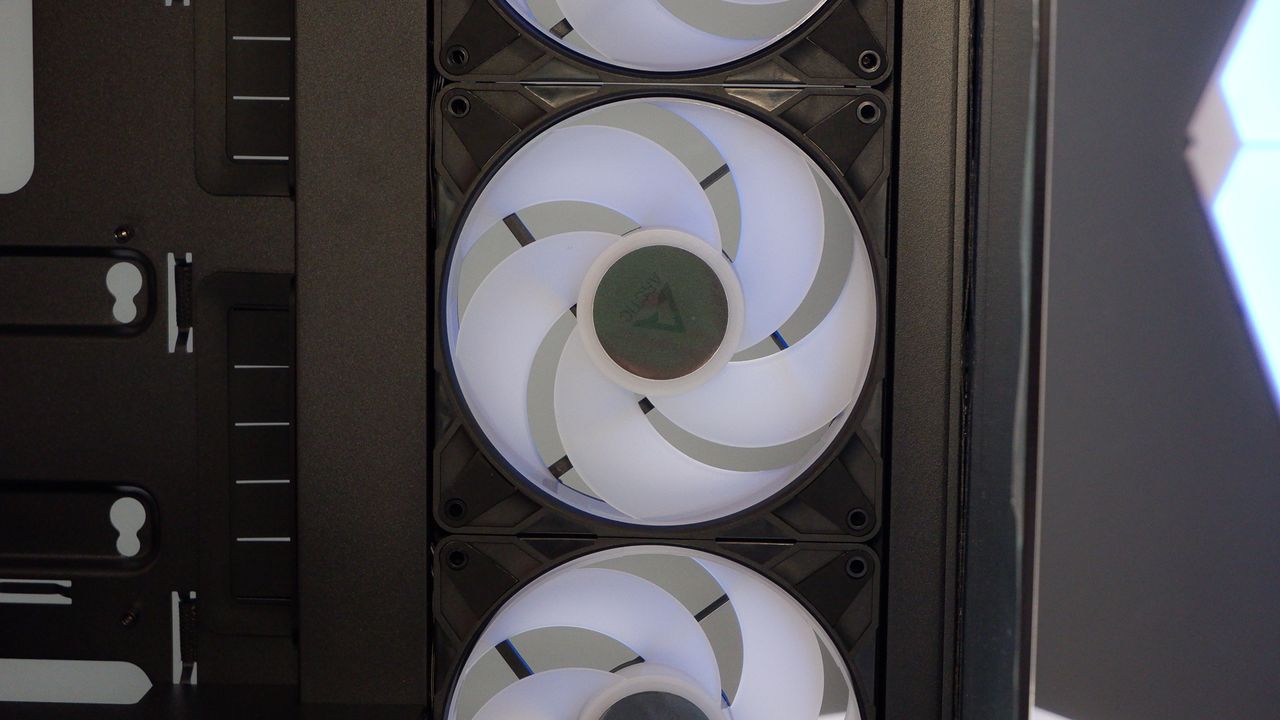 Arctic's Xtender PC case on a white desk with various parts being installed to build a functional gaming PC.