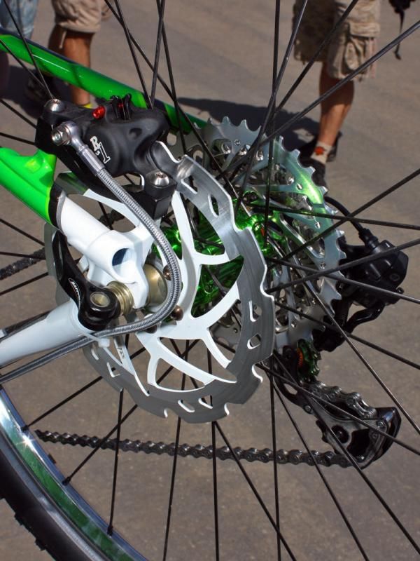 Formula R1 calipers clamp down on SiCp-reinforced aluminum metal matrix rotors from Scrub Components.