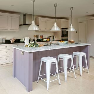 kitchen with white stool and hanging light