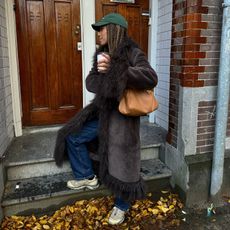 Amaka Hamelijnck in a brown Charlotte Simone coat