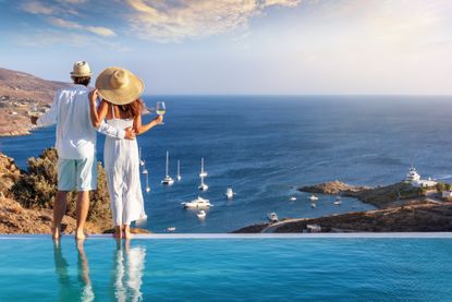 Couple at a luxury hotel on a vacation in Greece