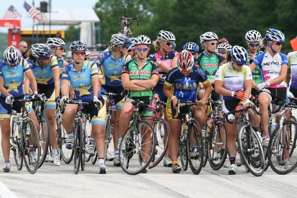 The professional women wait for the racing to begin at the historic motorsport venue.