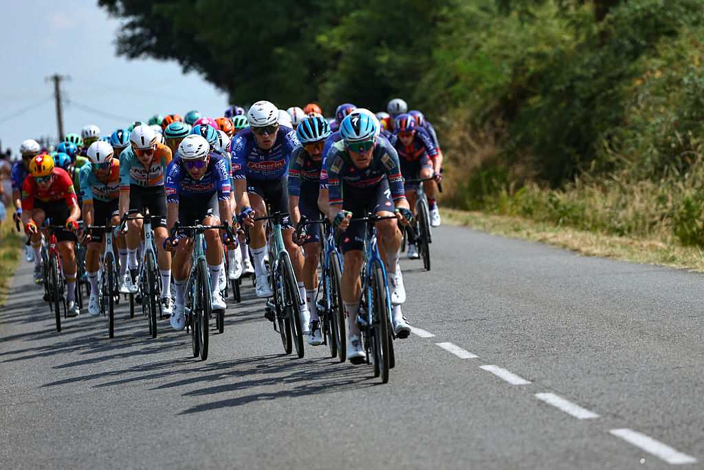 The pack of riders (peloton) cycles during the 7th stage of the 113th edition of the Tour de France cycling race, 175,1 km between Hagetmau and Bordeaux in southwestern France, on July 10, 2026. (Photo by Anne-Christine POUJOULAT / AFP)