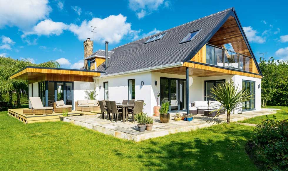 Contemporary extension with balcony to dormer bungalow.