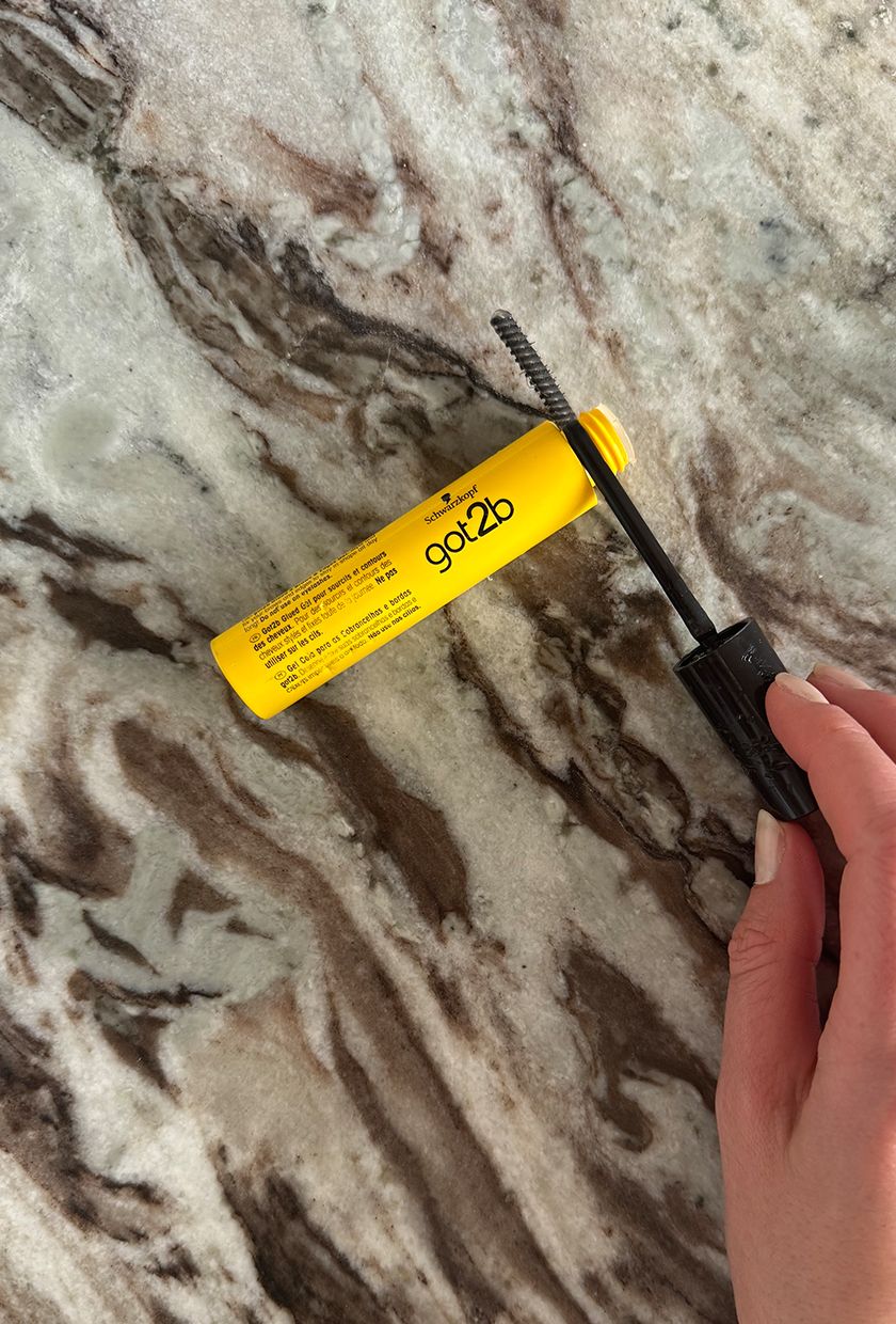 A photo of Got2b gel wand on a marble table