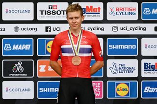 GLASGOW SCOTLAND AUGUST 05 Bronze medalist Felix rnKristoff of Norway celebrates winning during the medal ceremony after the mens junior road race at the 96th UCI Glasgow 2023 Cycling World Championships Day 3 1277km course in Glasgow UCIWWT on August 05 2023 in Glasgow Scotland Photo by Dario BelingheriGetty Images