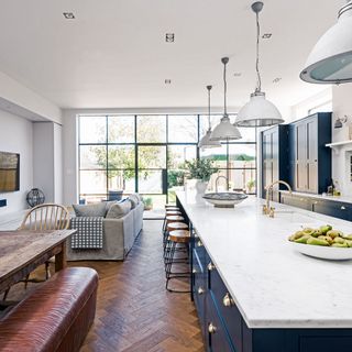 kitchen cabinet with crittall windows and wooden flooring