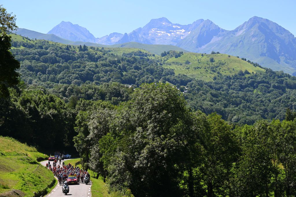 PLATEAU DE BEILLE FRANCE JULY 14 A general view of the peloton competing at the Col de Peyresourde 1569m during the 111th Tour de France 2024 Stage 15 a 1977km stage from Loudenvielle to Plateau de Beille 1782m UCIWT on July 14 2024 in Plateau de Beille France Photo by Tim de WaeleGetty Images