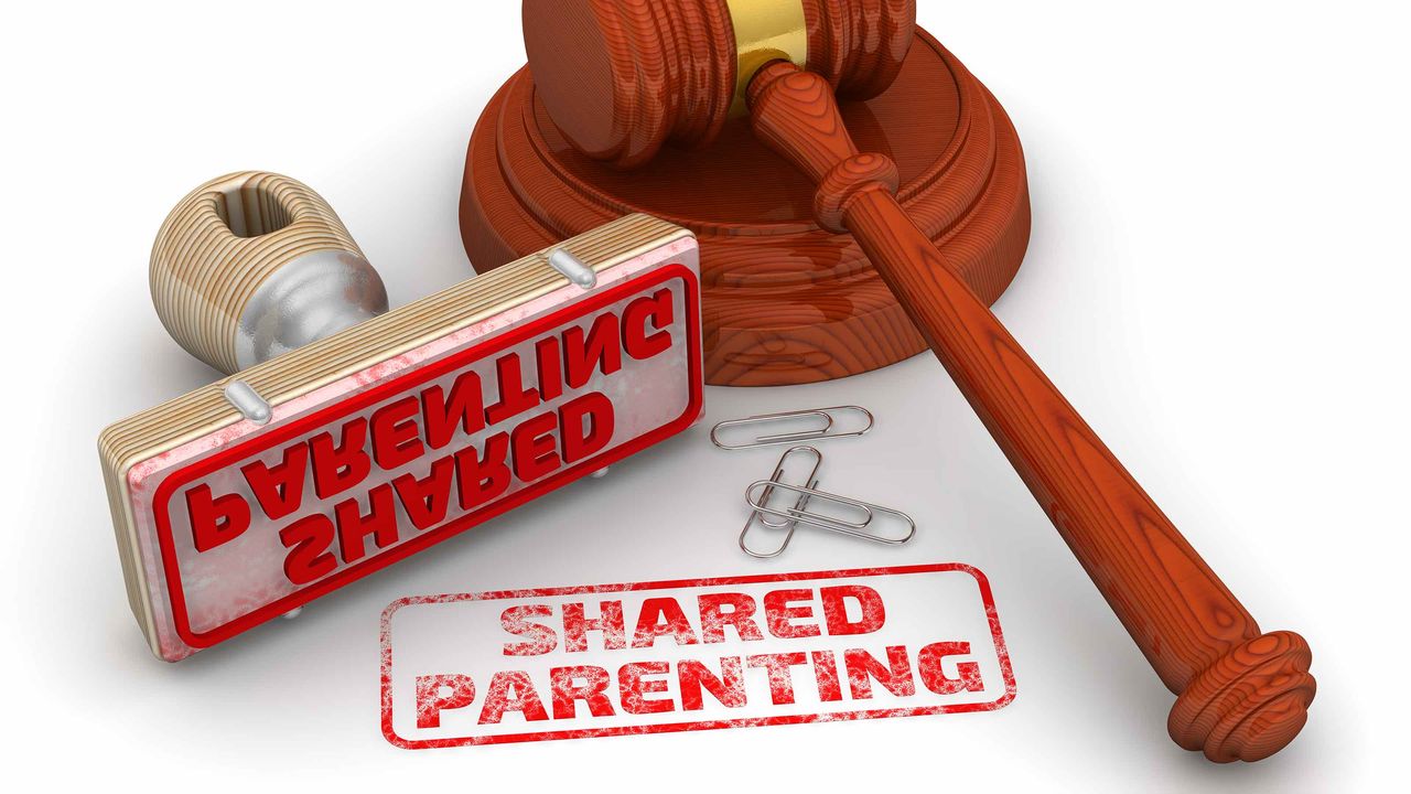 picture of judges gavel and a rubber stamp that says &amp;quot;shared parenting&amp;quot;