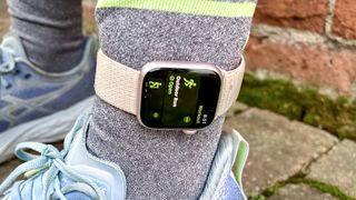 A photo of the Apple Watch 9 worn on the ankle