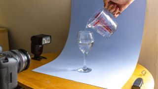 Home photography ideas: Whip up a storm with flash and a glass of water!