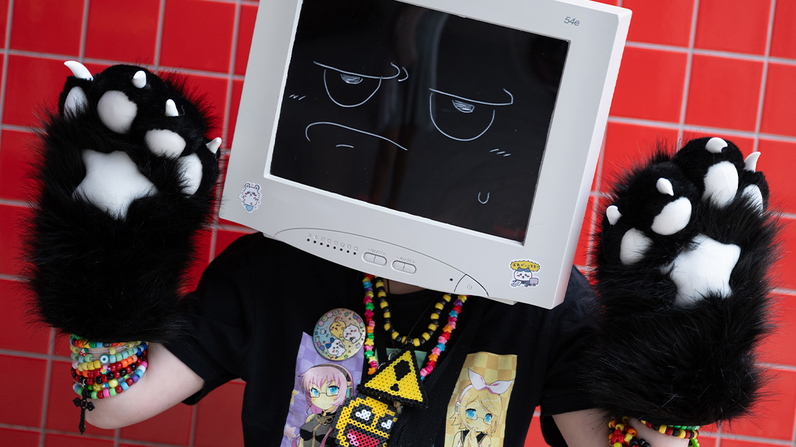 A person with a monitor for a head and paws