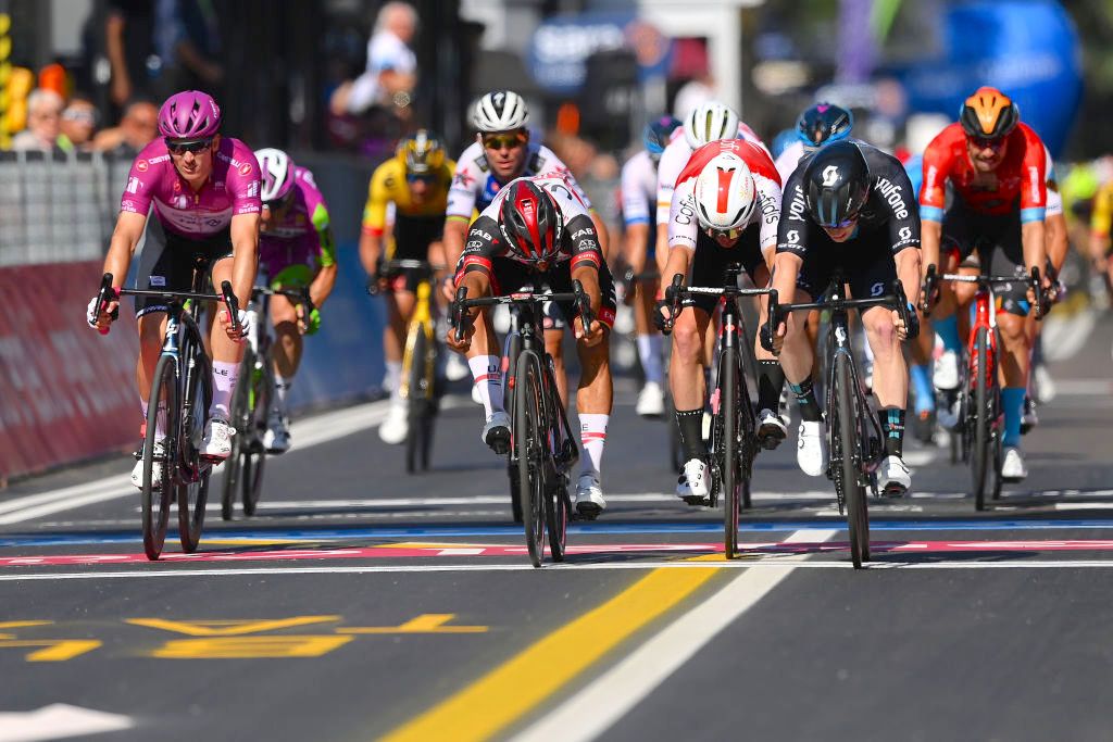 REGGIO EMILIA, ITALY - MAY 18: (L-R) Arnaud Demare of France and Team Groupama - FDJ Purple Points Jersey, Fernando Gaviria Rendon of Colombia and UAE Team Emirates, Simone Consonni of Italy and Team Cofidis and Alberto Dainese of Italy and Team DSM sprint at finish line during the 105th Giro d'Italia 2022, Stage 11 a 203km stage from Santarcangelo di Romagna to Reggio Emilia/ #Giro / #WorldTour / on May 18, 2022 in Reggio Emilia, Italy. (Photo by Tim de Waele/Getty Images)