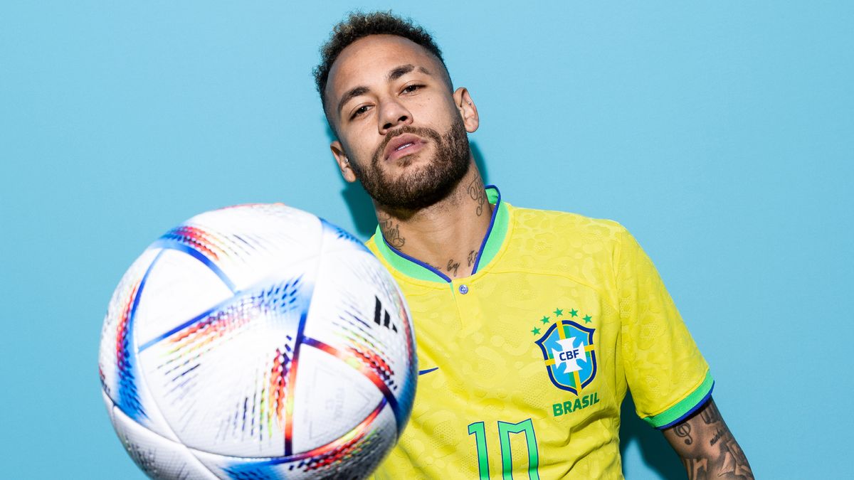 Neymar of the Brazil National Team poses with a football for the FIFA World Cup 2022 photo call in Qatar. 