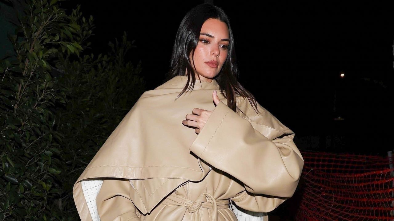 Kendall Jenner wearing a Bottega Veneta tan leather trench coat