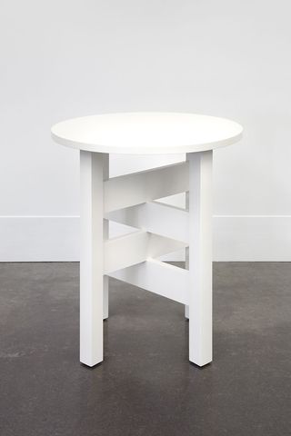 Small, round white lamp table