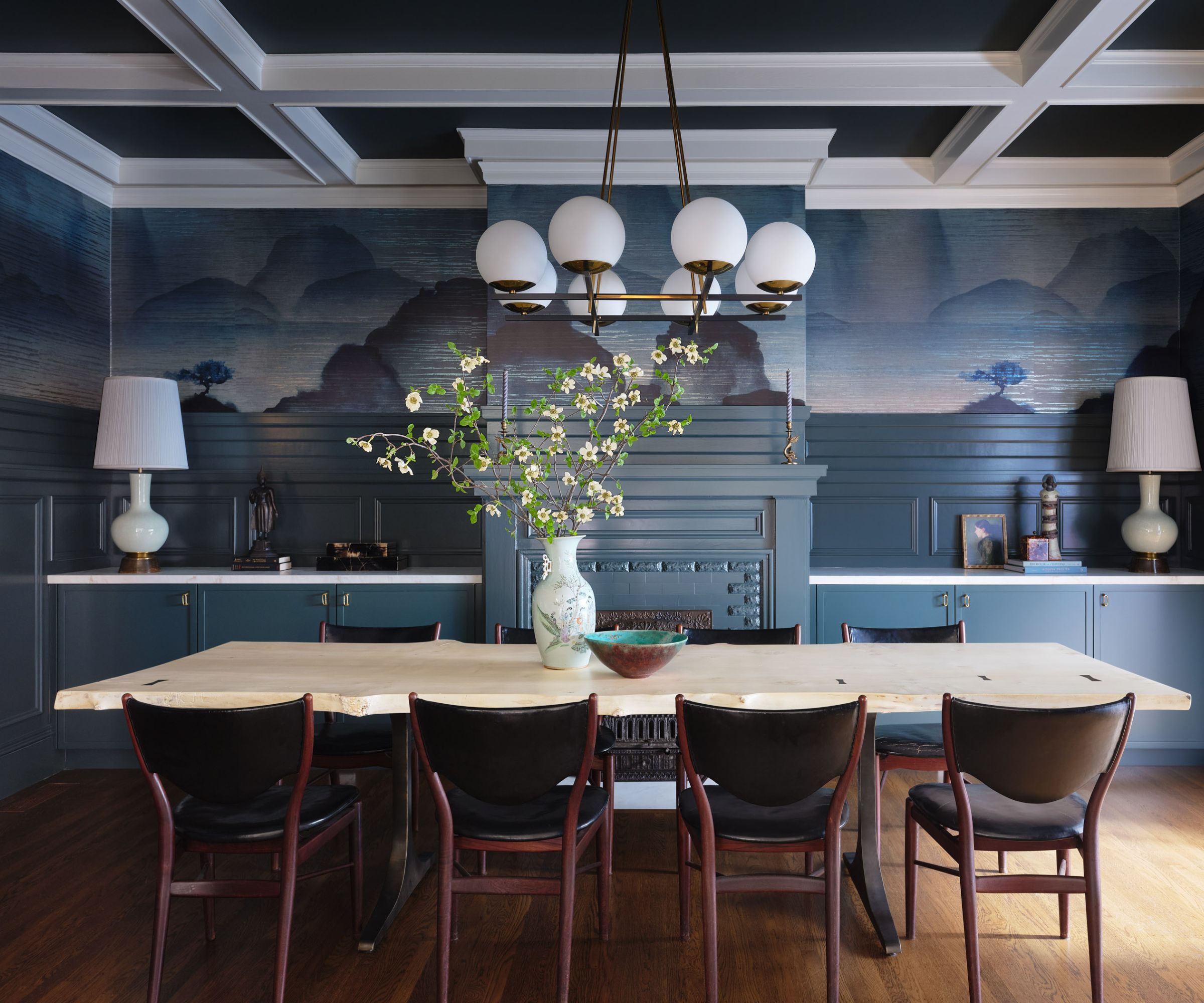 dining room with blue mural walls and paneled ceiling