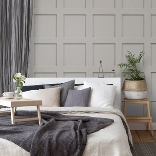 Bedroom with panelled effect grey wallpaper