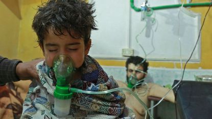  Syrian children and adults receive treatment for a suspected chemical attack