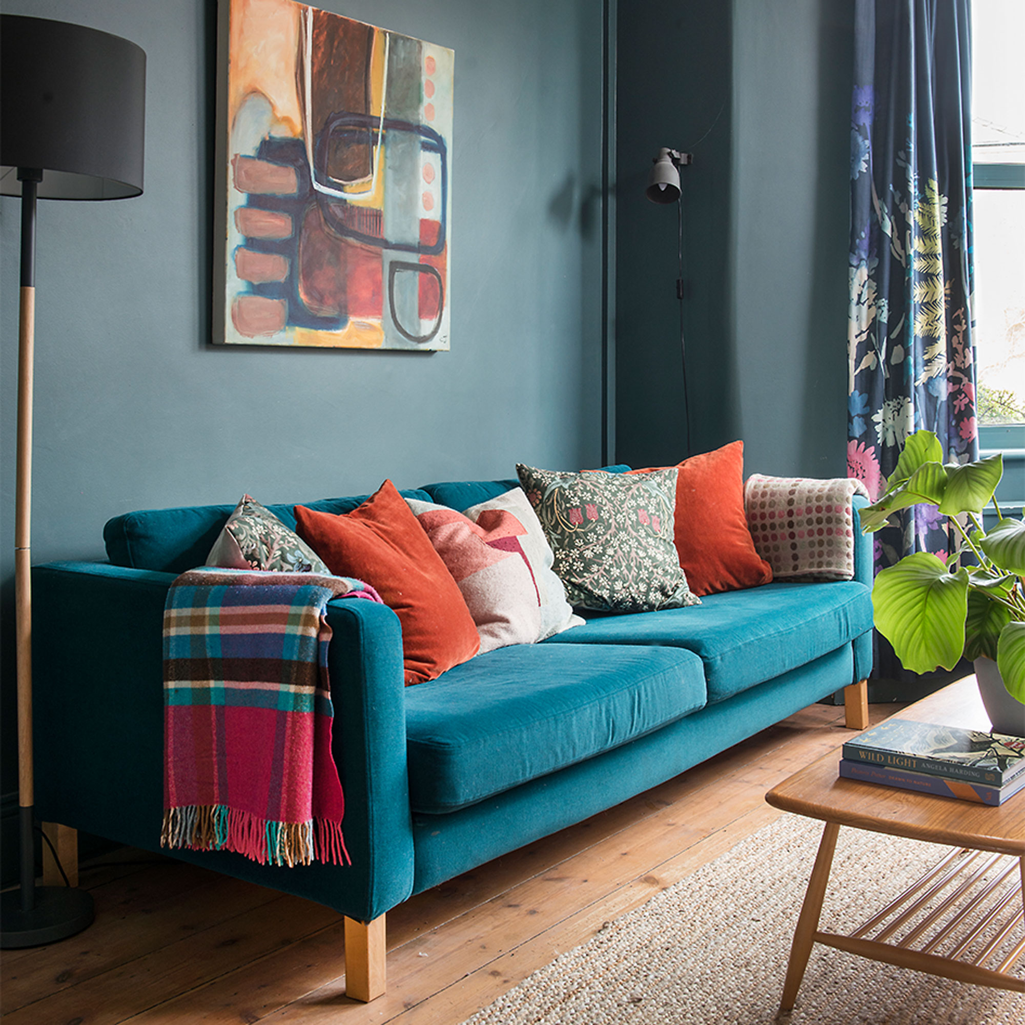 blue living room with blue velvet sofa