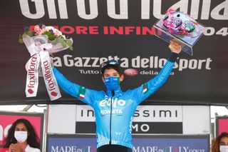 Team EOLO Kometa Cycling Team rider Italys Lorenzo Fortunato celebrates on the podium after winning the 14th stage of the Giro dItalia 2021 cycling race 205km between Citadella and Monte Zoncolan on May 22 2021 Photo by Luca Bettini AFP Photo by LUCA BETTINIAFP via Getty Images