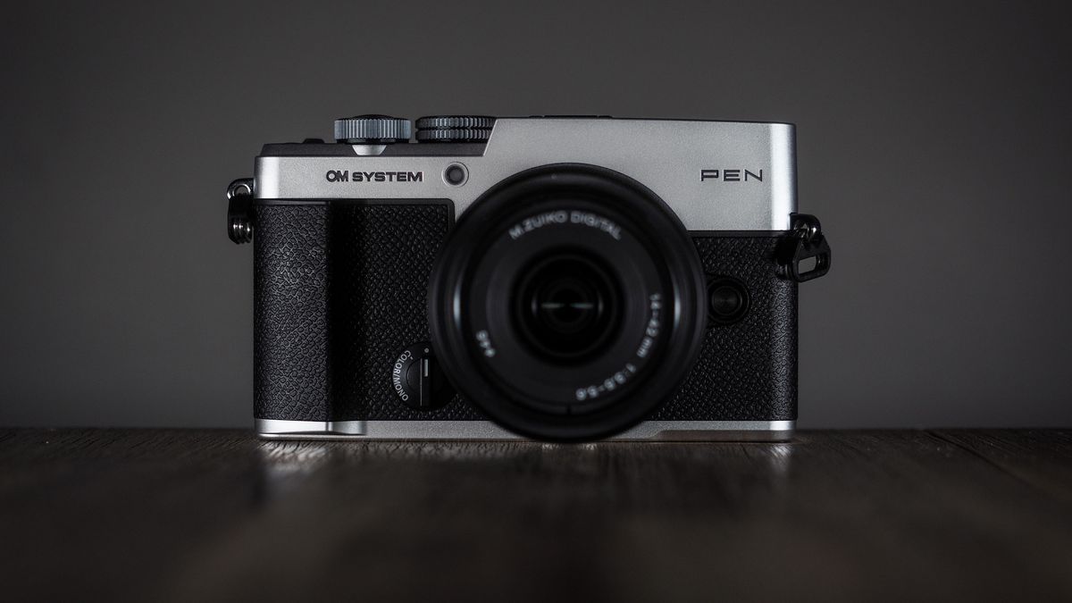 OM System OM-3 with the OM System M.Zuiko 14-42mm 3.5-5.6 III on a wooden surface