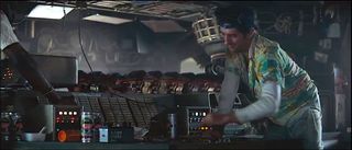 A man in a Hawaiian shirt aboard a spaceship