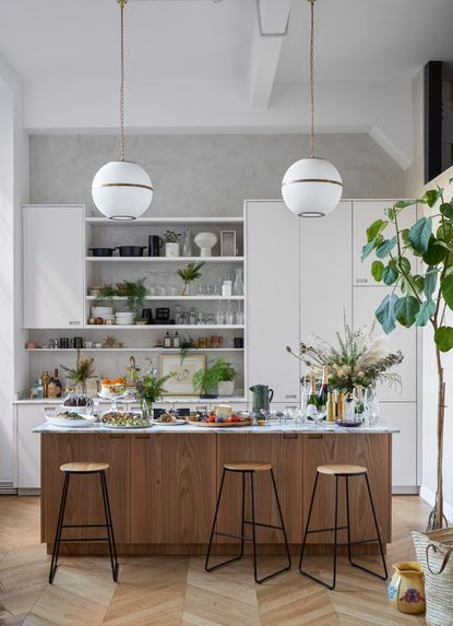 Modern wooden kitchen with globe pendant lighting